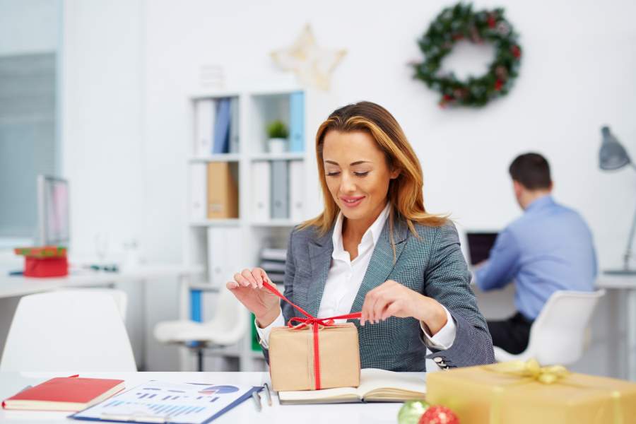 Employee Opening A Holiday Gift