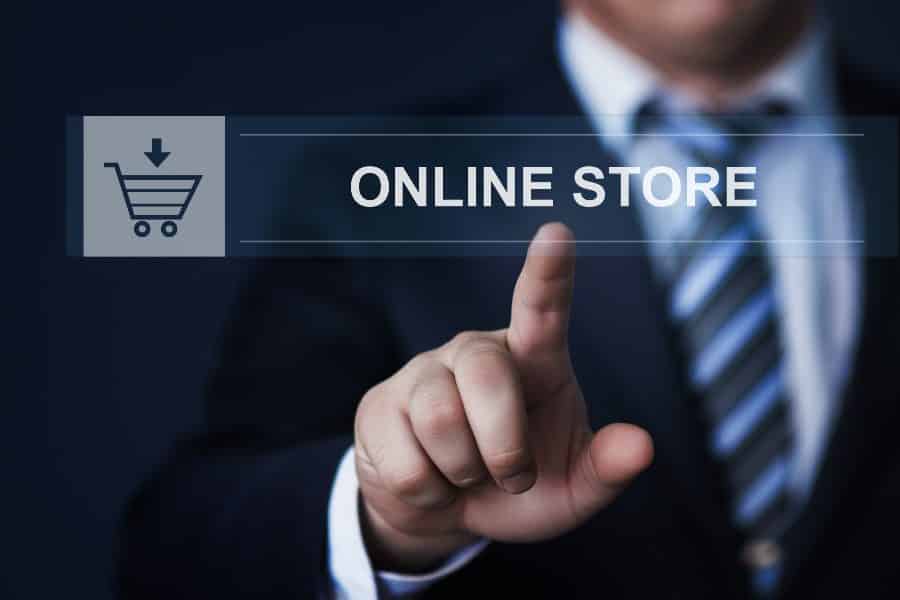 businessman pressing online store button on virtual screens