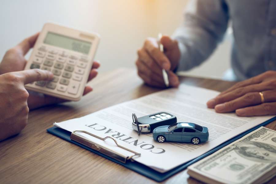 Finance Manager Car Showroom Calculating Cost