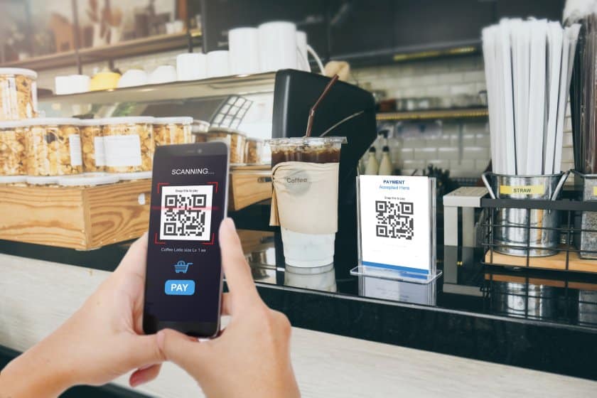 Paying through QR code in a store.