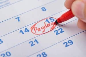 A calendar showing payday written on the 15th.