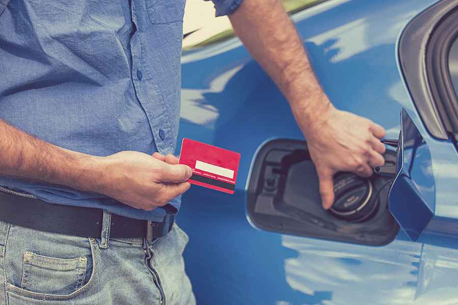 man holding a fuel card