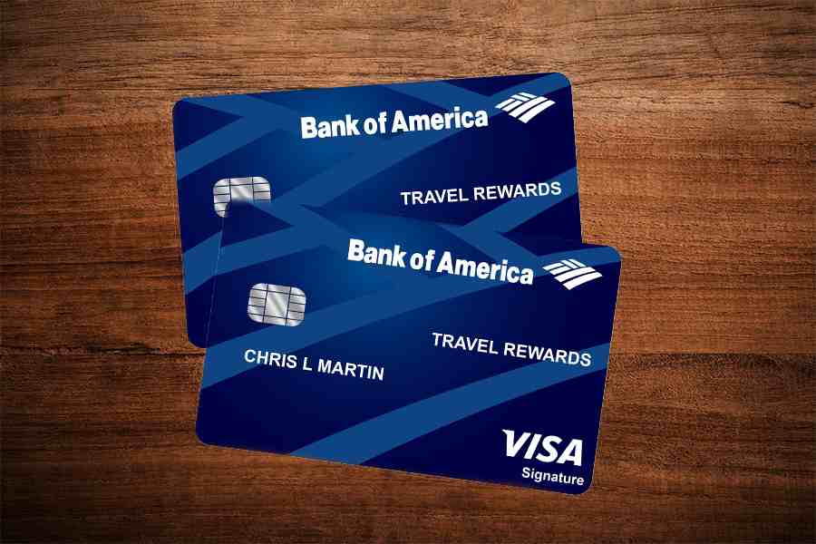 Two Bank of America® Business Advantage Travel Rewards World Mastercard® on top of a wooden table.