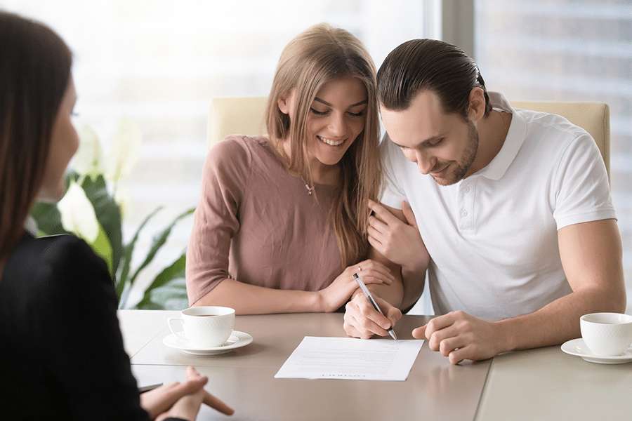 couple signing a document