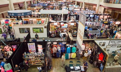 Visitors walk past stands at the Smoky Mountain Gift Show in Gatlinburg Convention Center, Gatlinburg, Tennessee