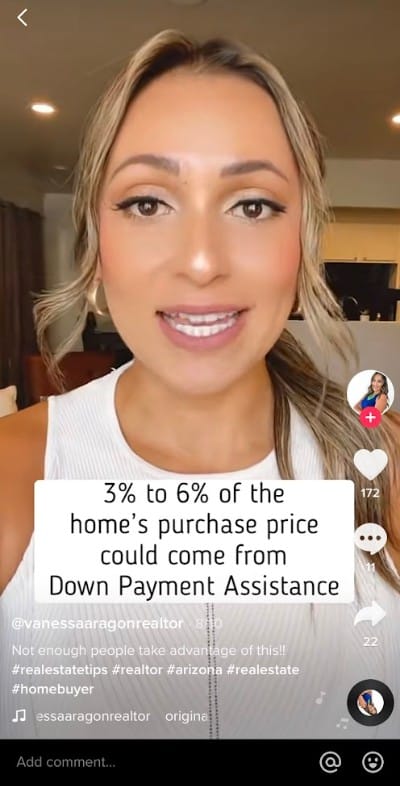 A Tiktok video with real estate hashtags.