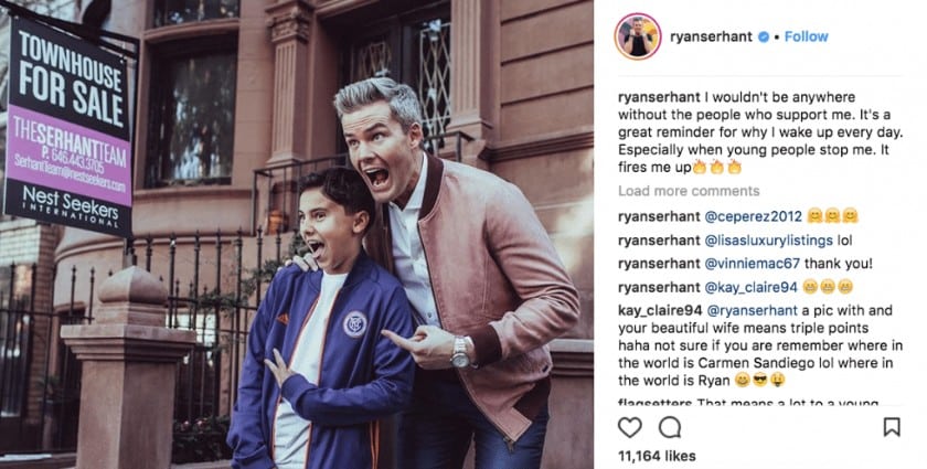 An image of Ryan Serhant and a kid getting picture together.