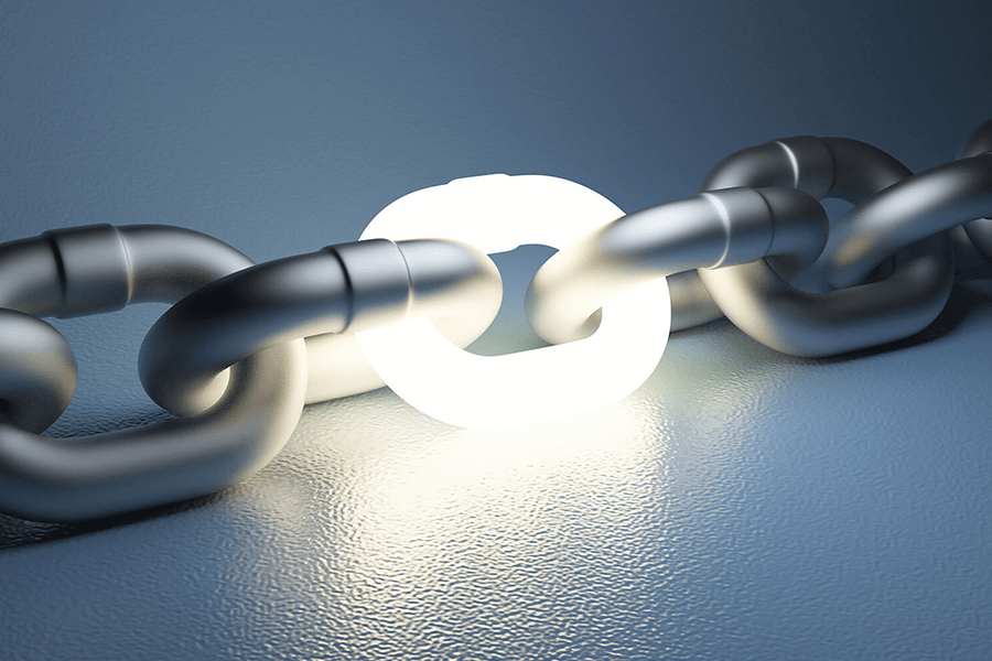Glowing chain link in steel chain.