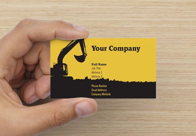 Business card design with a backdrop of heavy-duty construction.
