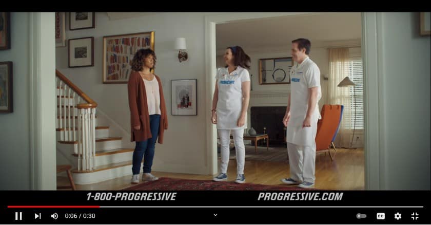 TV commercial of Progressive Insurance where a woman and two insurance company staff standing awkwardly.