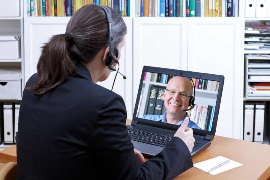 Having a one on one virtual meeting.