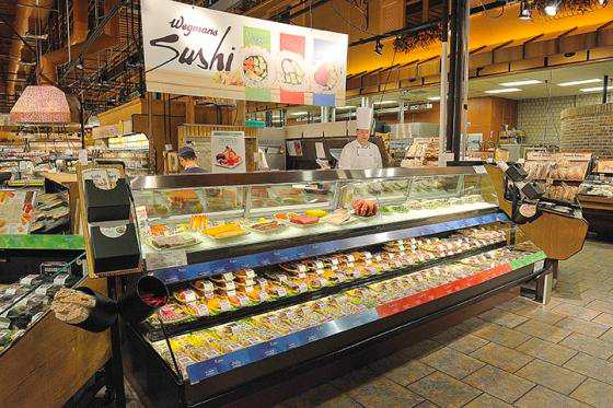 Showing fish meat and sushi counter.