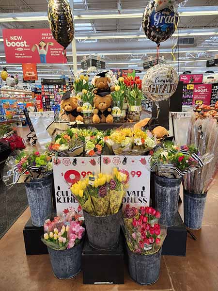 Graduation-themed display for flower bouquets.