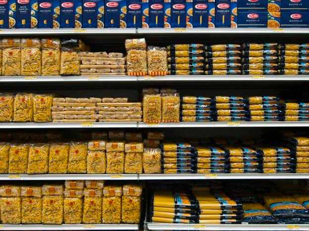 Showing grocer displays high price point organic pasta.