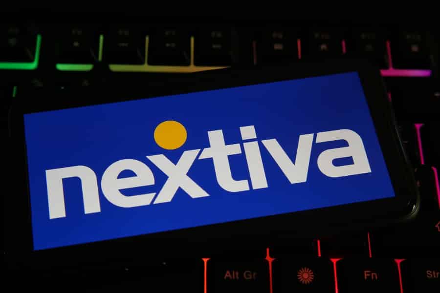 Close up shot of phone screen with Nextiva logo.