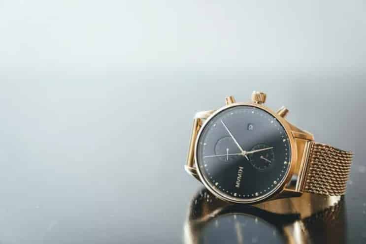 This product photo places the watch in the lower right corner with a simple reflection beneath it, leaving ample negative space in the majority of the frame.