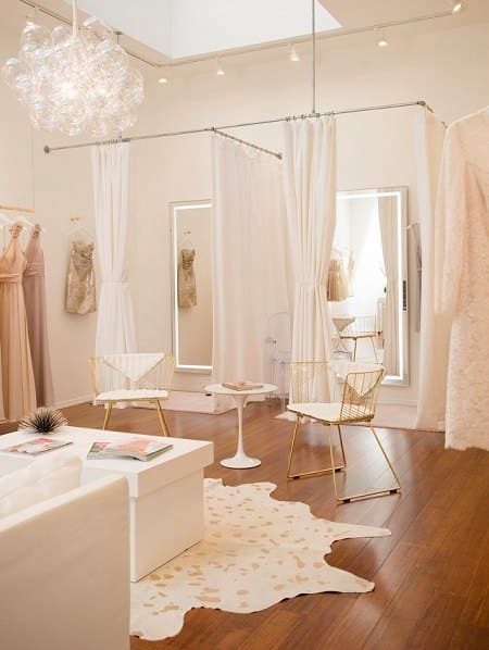 Fitting room with white bright girly colors.