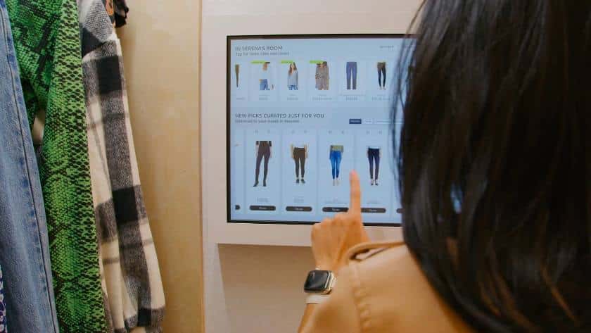 A customer using interactive touchscreen.