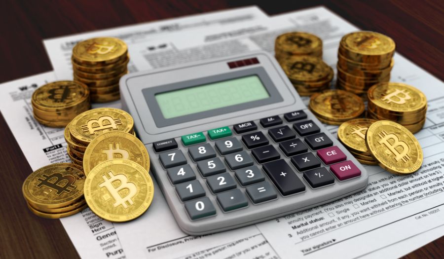 Calculator, documents and piles od Bitcoins.