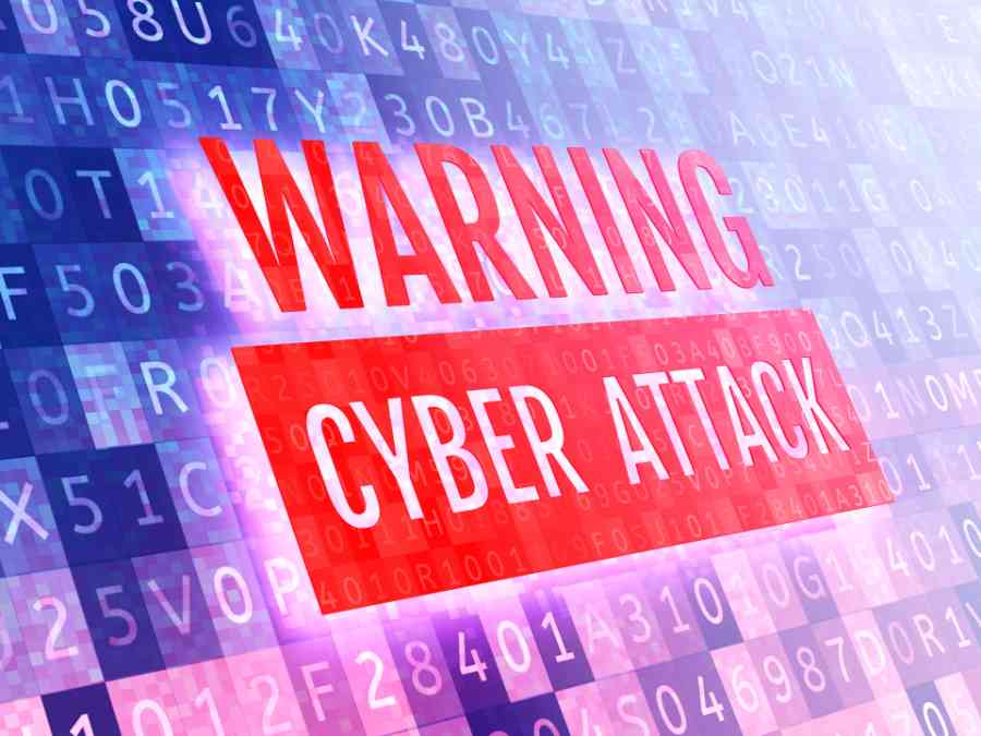 Warning cyber attack sign with a background pattern of letters and numbers.