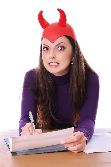 Woman wearing devil horns Halloween headband.