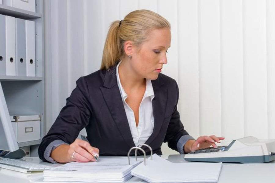 Female employee working on documents.