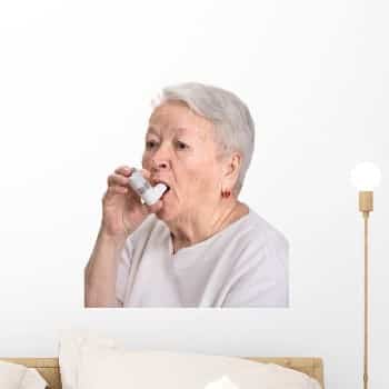 Senior woman with asthma inhaler wall decal.