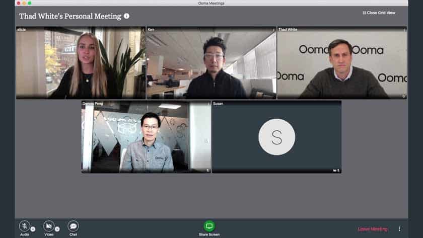 Business people are doing video conferencing at Ooma.