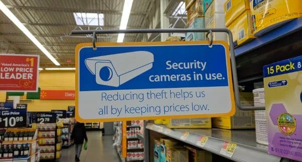 Showing a security camera in use sign.
