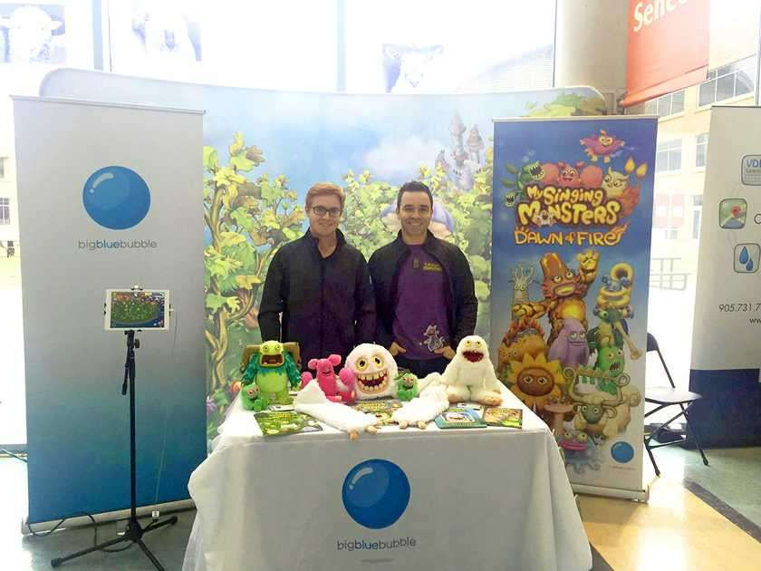 Showing video game developer attract job seekers with colorful and fun display.