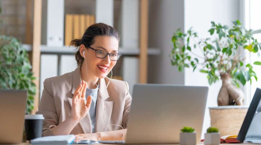 Showing a woman wearing blazer over a simple t-shirt for the meeting.