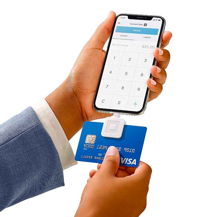 A person scanning credit card using mobile device.