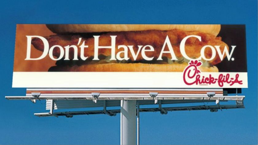 A billboard ad from Chick-fil-a telling viewers "don't have a cow."