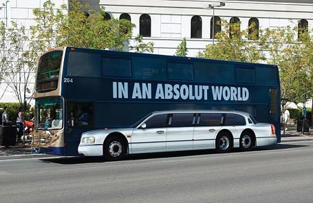 A bus with ad that says "In an Absolut World".