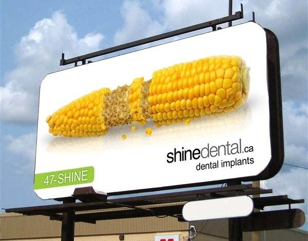 shinedental.ca billboard ad with an ear of eaten corn on a white background.