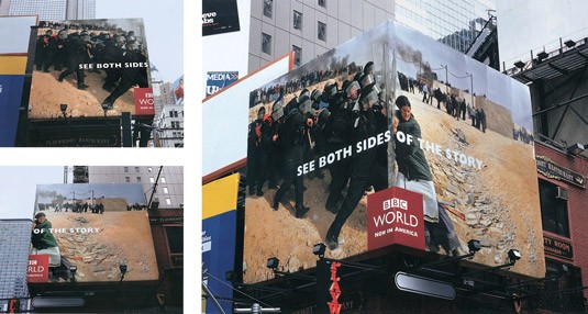 A billboard design that wraps a corner of a building and showing a BBC world news.