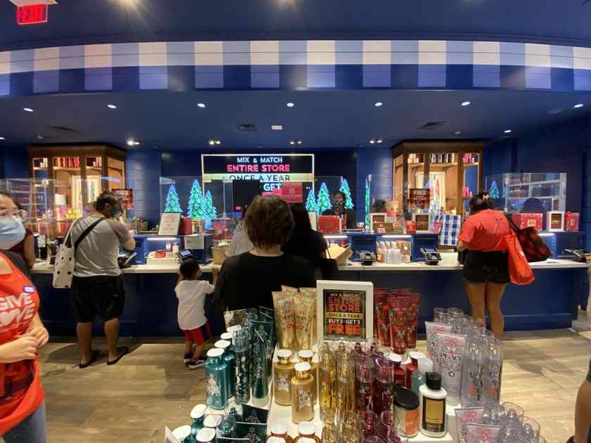Showing a busy Bath & Body Works counters.