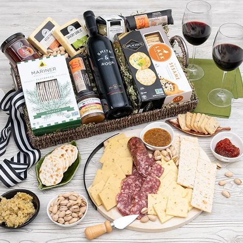 Giving gourmet cheese and wine basket as a closing gift from Gourmet Gift Baskets.