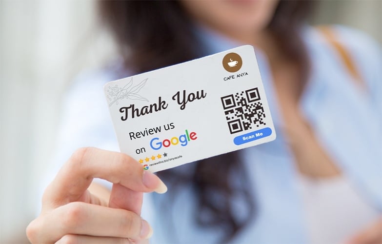 Business card with a QR code asking for Google Reviews.