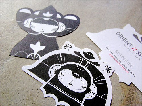 Business cards with custom graphic die-cut design.