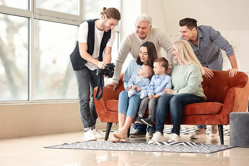 Family photoshoot with a professional photographer in their new living room.