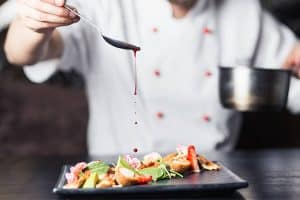 A chef plating.