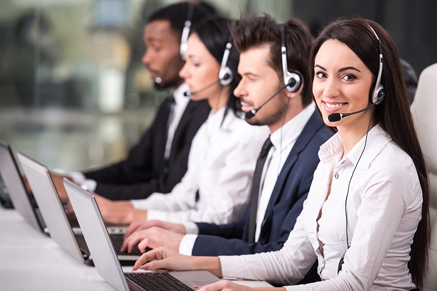 Call center employees are happily working.