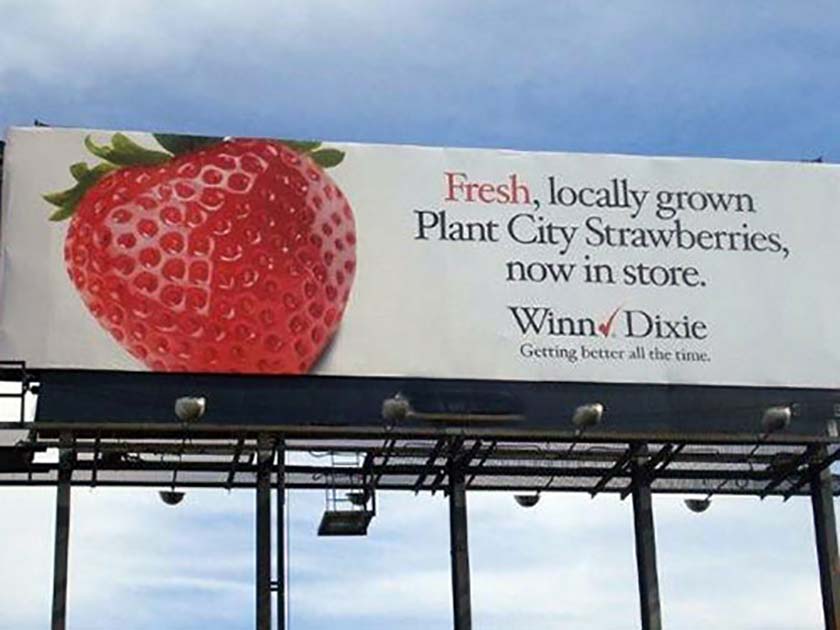 Traditional billboard advertising a grocery store.