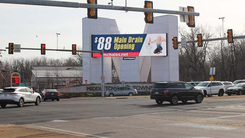 Digital billboard advertising a home repair service.