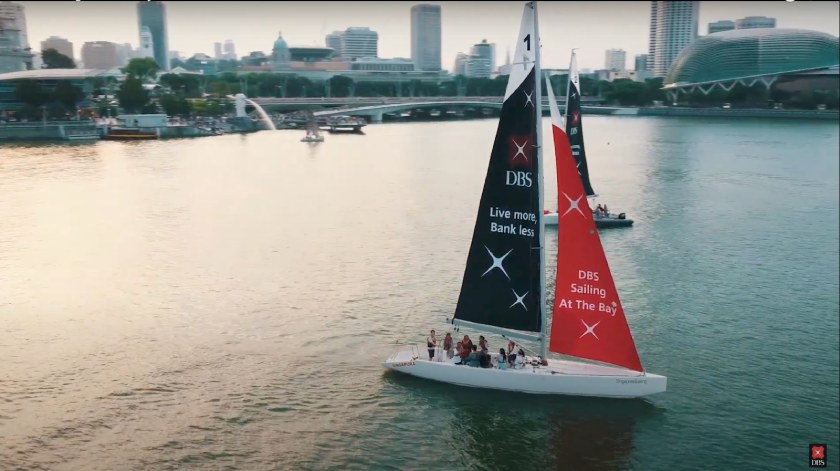 Sailboats along Marina Bay in Singapore branded with DBS Bank.