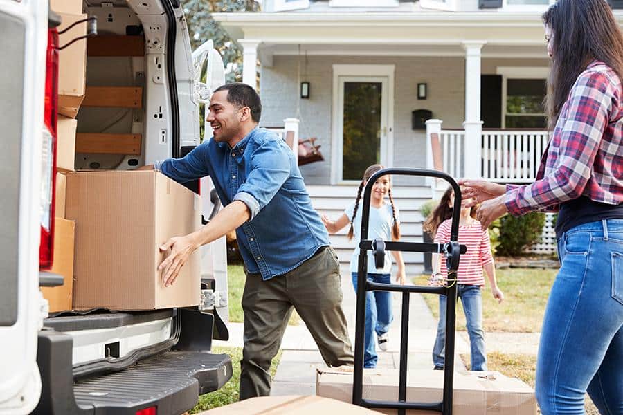 Unloading boxes from a van.