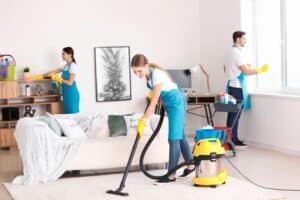 Team of janitors cleaning an apartment.
