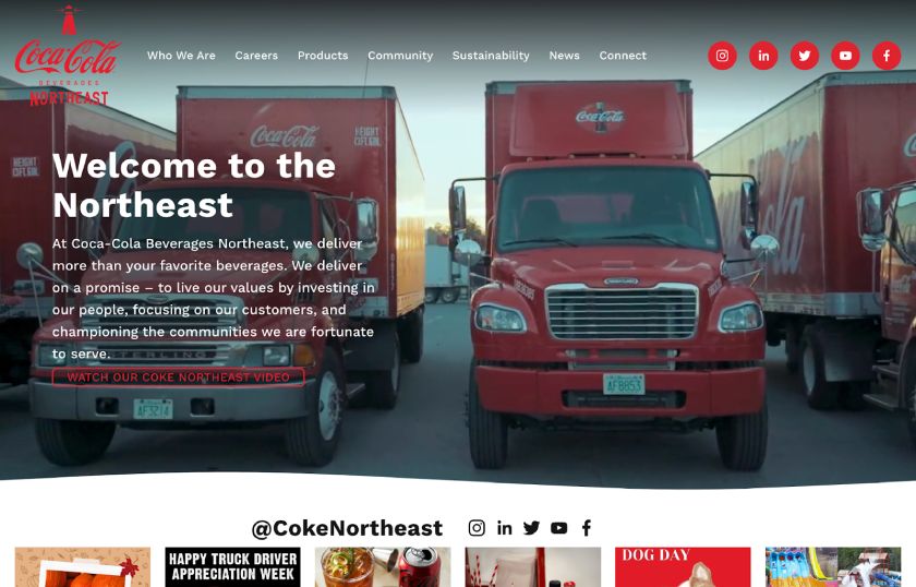 The Coca-Cola Beverages Northeast home page featuring a banner image of branded delivery trucks overlaid with a short header, a one-paragraph description, and bright social media icons in the top-right navigation.