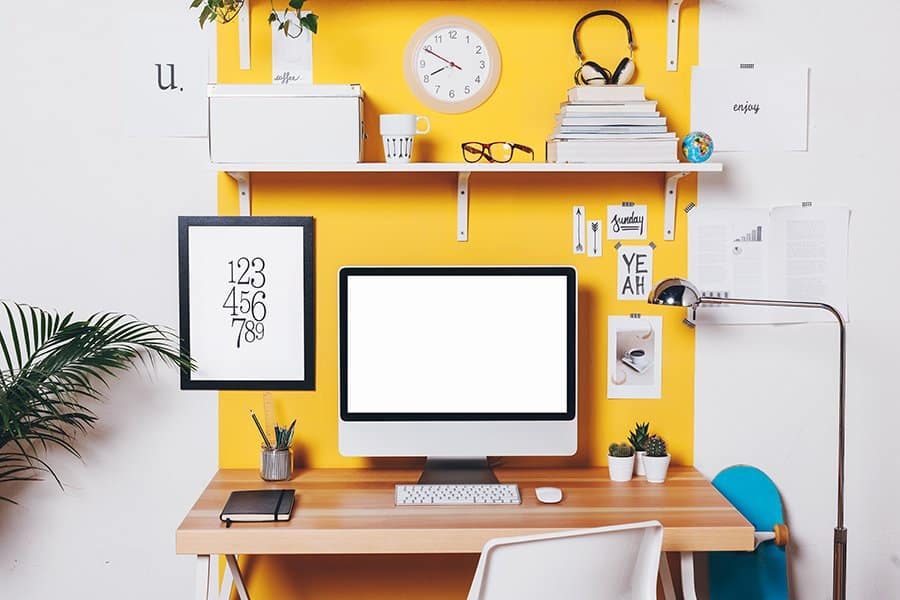 Home office painted with bright yellow color